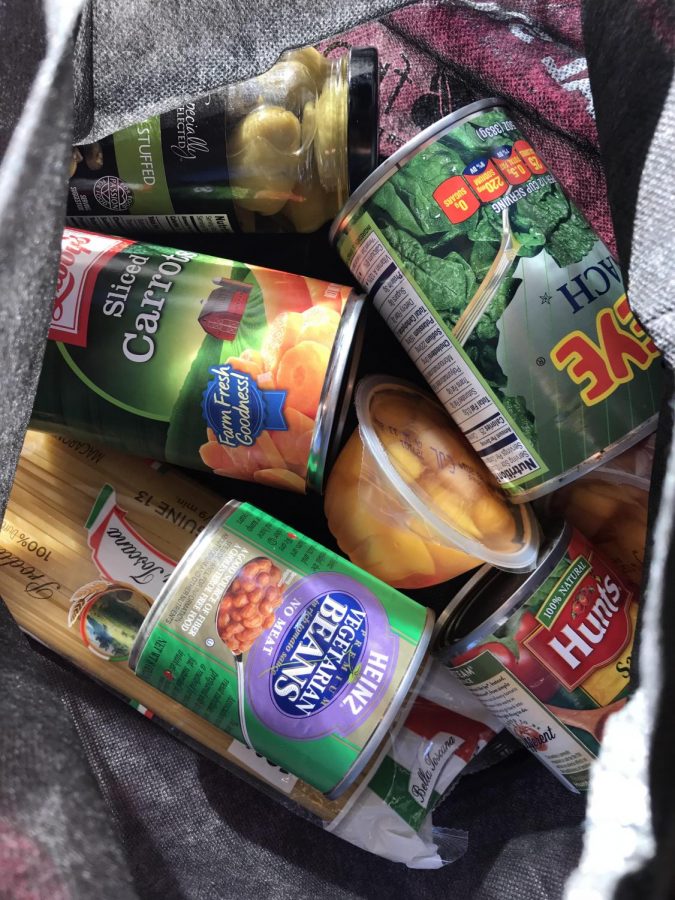 Picture of Cal State LA Fresh bag filled with carrots, beans, and other canned food essentials.