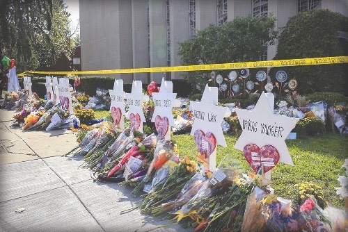 A lot of families set up memorials with flowers, balloons, and names to remember the lost ones in this picture