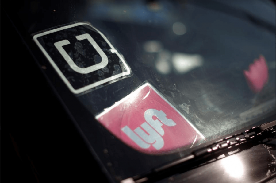 A picture of a car with it's uber and left logos.
