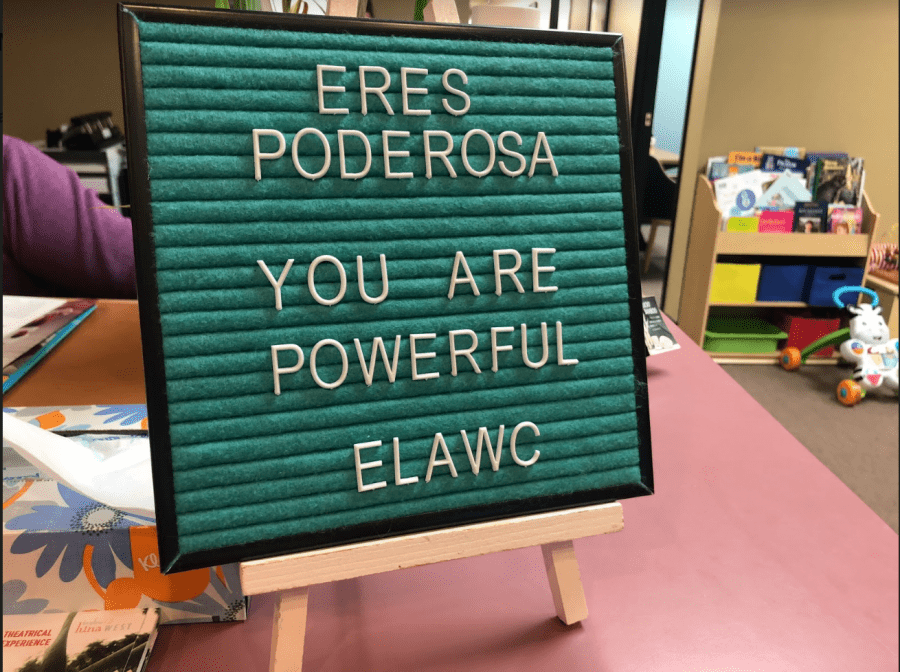A sign which is stating Eres Poderosa: You are powerful: ELAWC