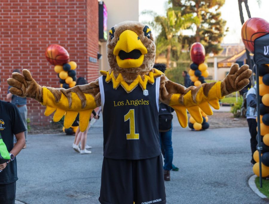 Eddie the Eagle, Cal State LAs mascot, poses for a photo in front of the Eagles Nest Gym.