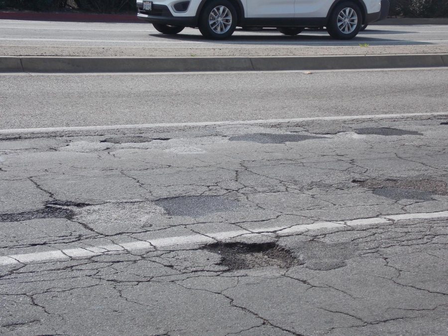 Potholes dot Valley Boulevard. (Monica Tamayo/Community News)