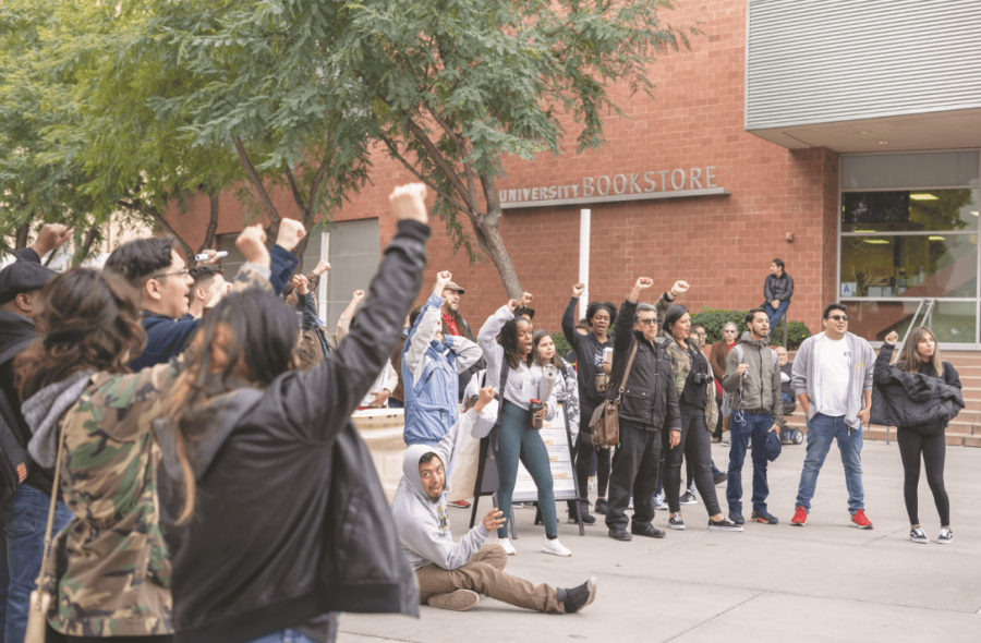 Protestors+with+fists+held+high+as+a+symbol+of+unity+and+strength+for+the+students+of+Cal+State+L.A.