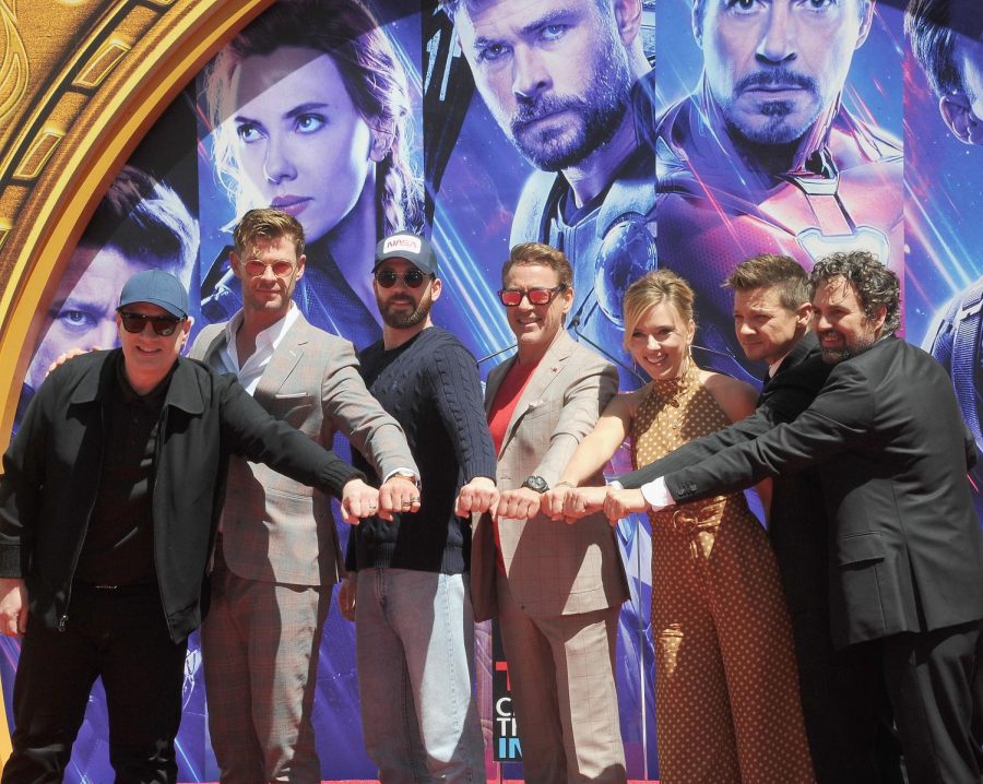 Picture+of+the+avengers+cast+is+holding+their+hands+into+a+circle+as+they+pose+for+a+picture.