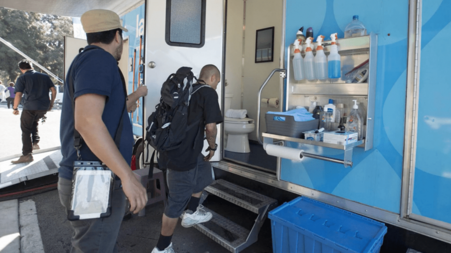 Folks line up to use mobile showers. Photo courtesy of Los Angeles County.
