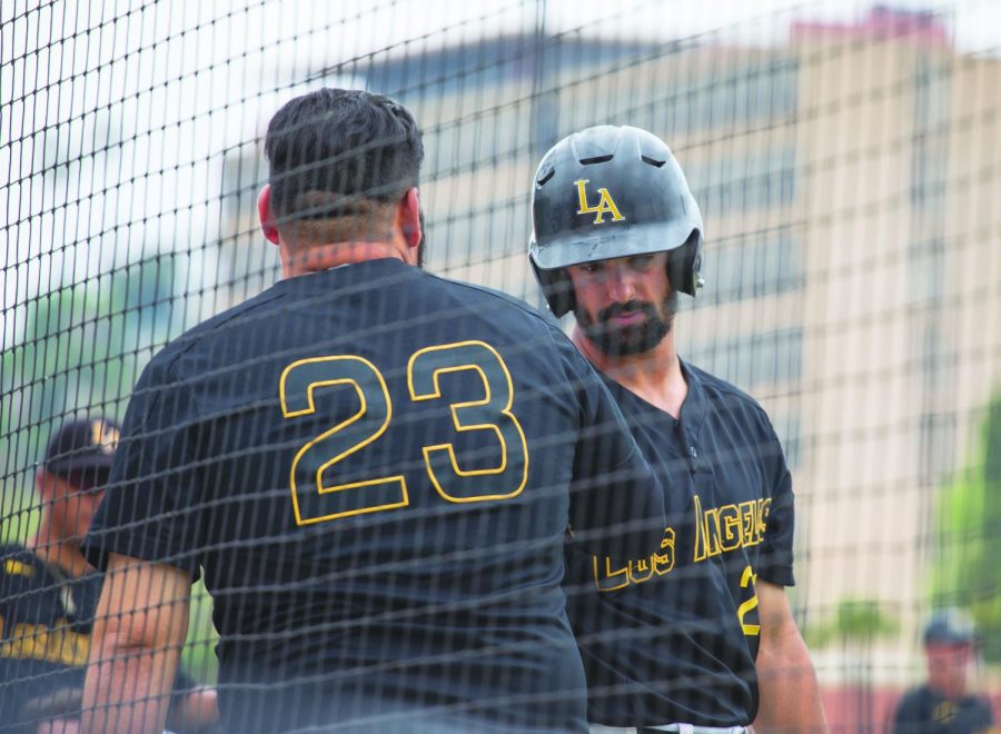 After finishing eighth in the conference this season, the Golden Eagles will miss the playoffs for the first time since 2016. Pictured: (left) third baseman Anthony Moreno (23) and (right) right fielder Adam Gordon (29) meet at home plate.