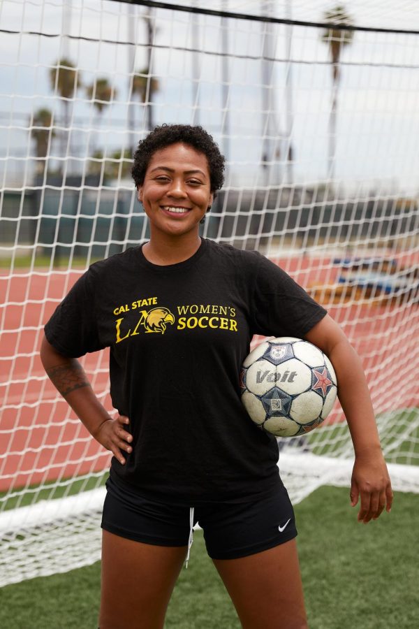 Picture of Golden Eagle Womens Soccer forward, Leslie Ramirez with a soccer ball on her hip.