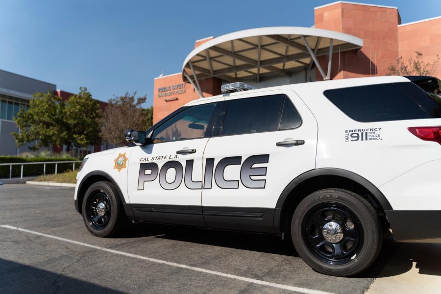 A SUV stationed in front of the Public Safety building.