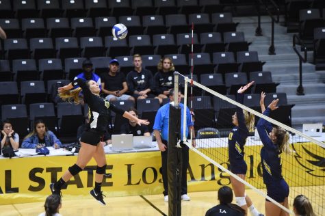 Alejandra Negron (20) reaches to hit the ball. The Cal State LA women's volleyball team defeated UC San Diego with a score of 3-0.