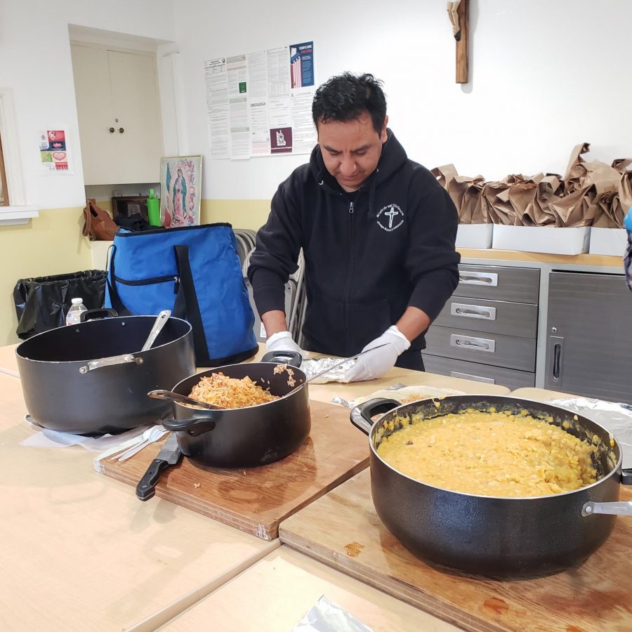 Andres Veano, a frequent volunteer, makes a burritos de carne de puerco.
