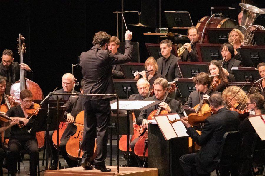 Conductor Paolo Bortolameolli leads the orchestra through songs from West Side Story.