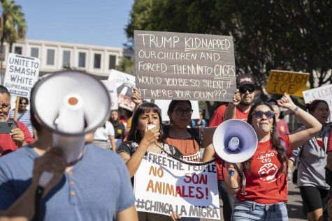 Protestors marching through Los Angeles using mega phones speak up as they chant against the ICE deportations that have been recently happening.