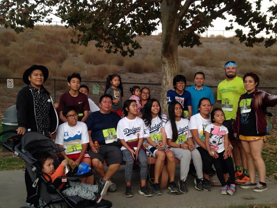 A group photo of everyone who participated in the run is shared. Before the vigil, everyone honored Andy by participating in one of his favorite activities, running.