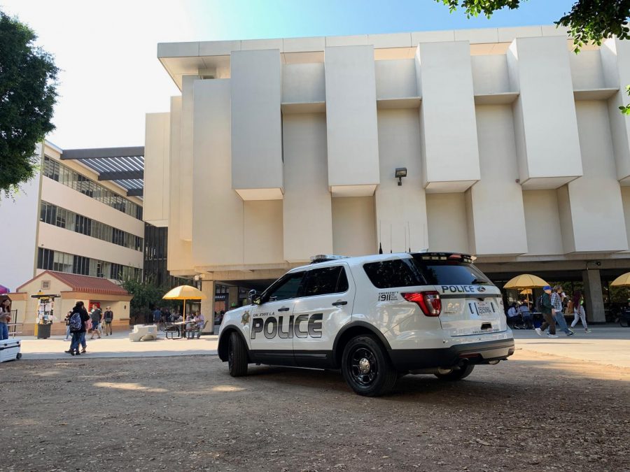 A Cal State LA campus police vehicle stations itself in the front of the library on Monday, November 4, 2019 at around 1:30PM. The library is the second mass shooting target to receive a threat in the span of one week
