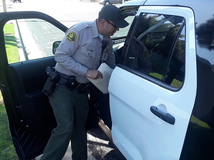 Deputy Daniel Padilla is at the sheriffs station in the city of Industry as he prepares for a 10-hour shift.