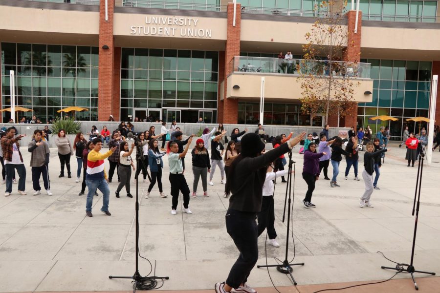 Step-by-step dance lessons are taught to those attending the K-pop dance workshop on campus.