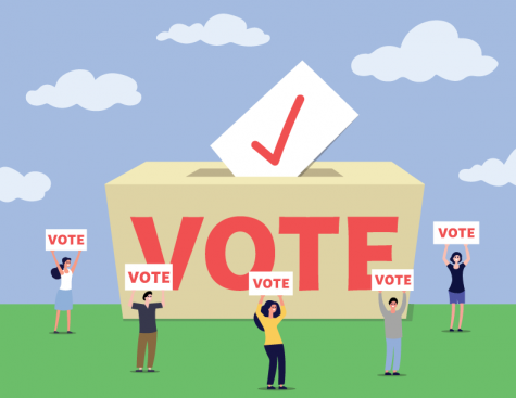 A group of people hold “vote” signs around a voting ballot.