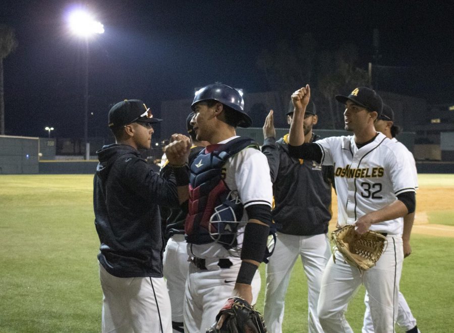 The baseball team celebrates a victory at the second game this past Friday against Northwest Nazarene.