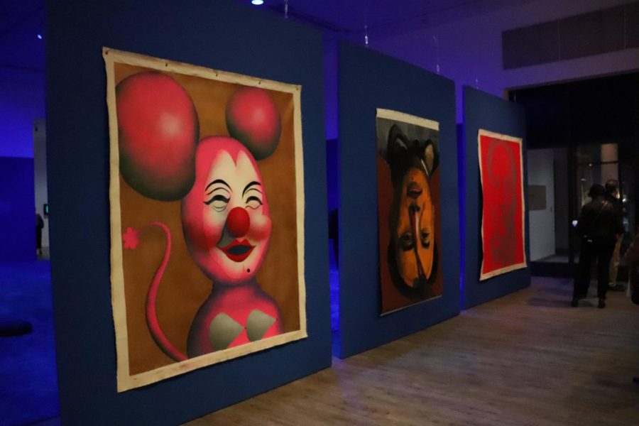 (From left to right) “Mini Mao,” “Mao is Coming,” and “Tinanamen Square Mao,” all by artist Tu-2, greet guests on their right as they walk into the Luckman Gallery.