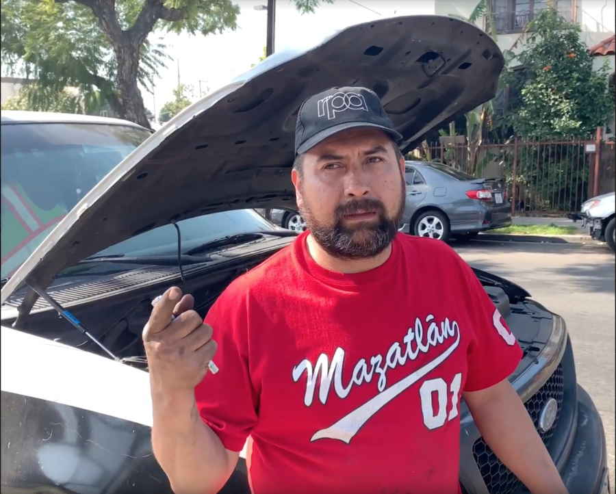 Victor Quiroz pictured working on his truck.