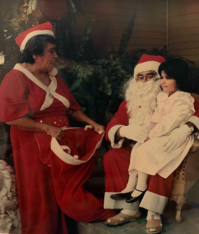 Bobby Lee Verdugo is shown dressed as Santa Claus for his family.