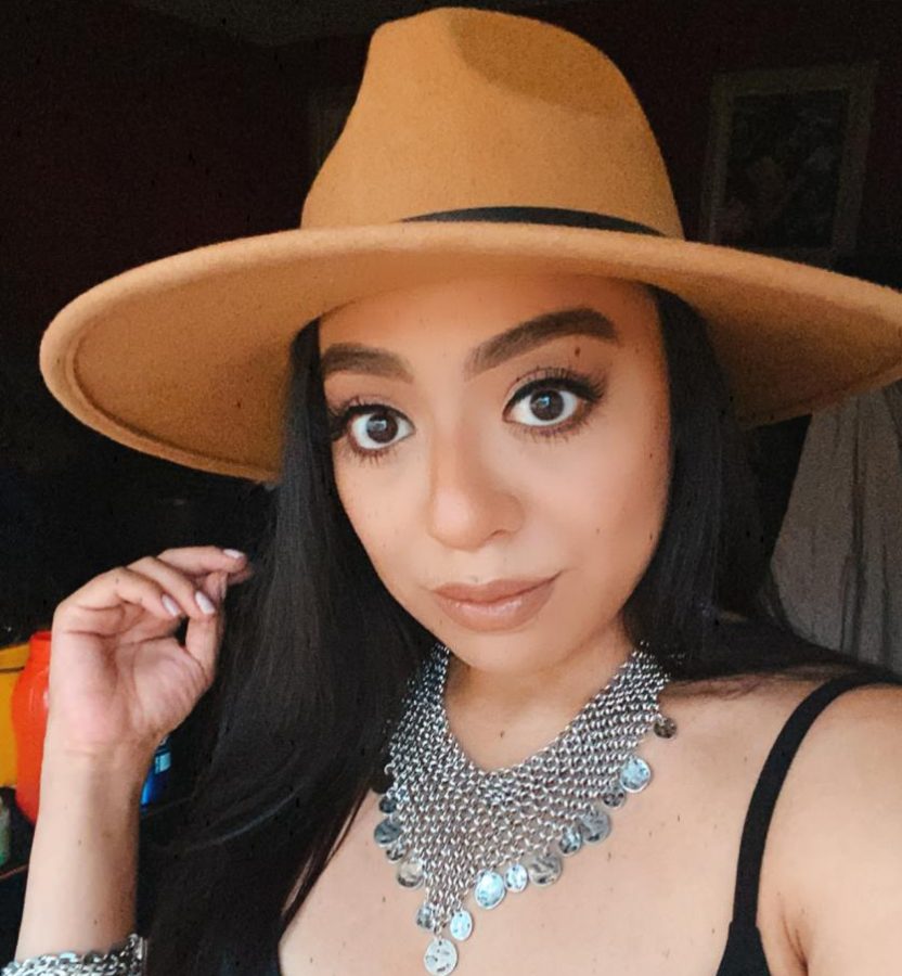 Photo of Solmayra Jacobo wearing a hat and silver jewelry. Photo is courtesy of Solmayra Jacobo.