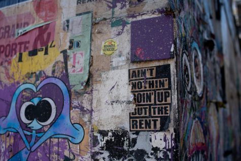  Graffiti including a sign about rising rent from a neighborhood in London, UK. Jan Gottweiss/Unsplash