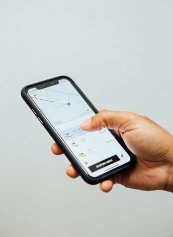 Photo of Rideshare app by Charles Deluvio courtesy of Unsplash