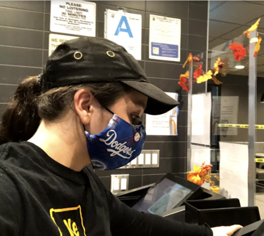 Woman with black cap working.