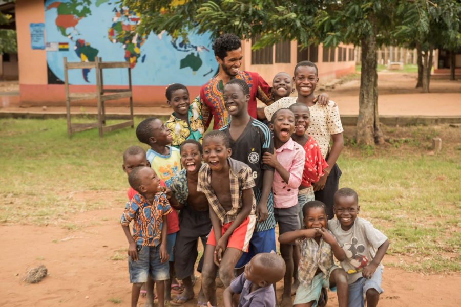 volunteer with children in Ghana