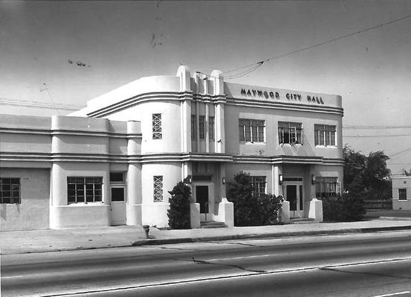 a black and white photo of a white Art Deco style building