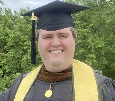 portrait of man with graduation attire