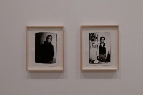 Photo displays two hanged framed pictures. Both are pictures of a man. 