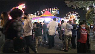 Residents of Lincoln Heights enjoying the fair. (by Braylin Collins, UT)