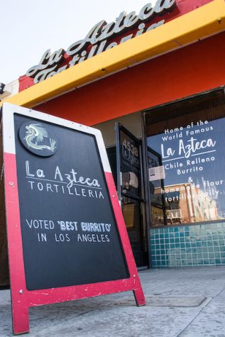 La Azteca's storefront with a signboard in front