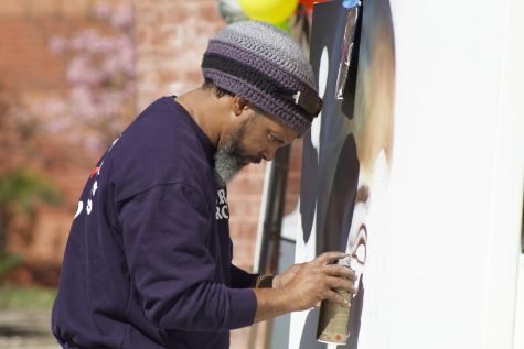 Artisit, Enkone spray painting at Cal State LA during the art walk.