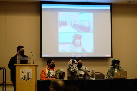Star Wars related event at Eagle Con. Four people are on stage dressed up as characters from Star Wars.