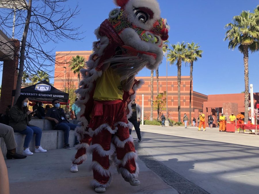 A Lion Dance being performed to chase away evil spirits of Cal State LA.