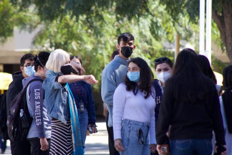 Cal State LA students wearing masks on campus.