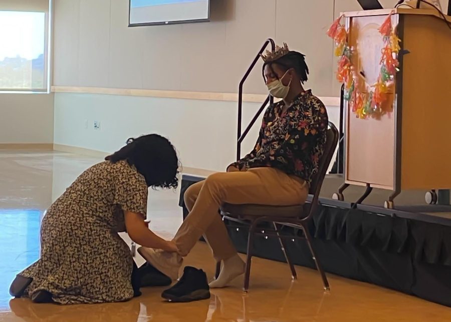AJ Chavez (the person knelt on the ground) replacing Deangelo Ramirezs shoe during the ceremony of turning into a new person. 