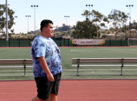 A guy going an a run for Ability Awareness Week