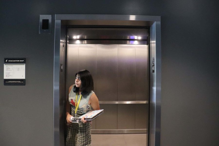 woman+getting+out+of+the+elevator