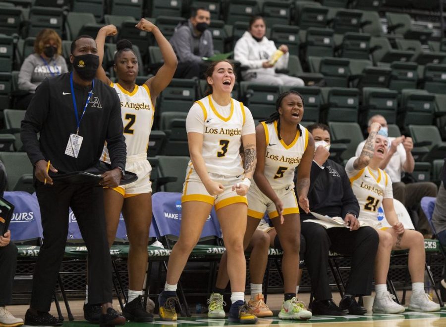 The women basketball team celebrating.