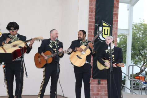 A mariachi band playing during the event
