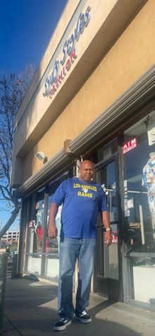 Business owner Carl Nelson, stands in front of his own business.