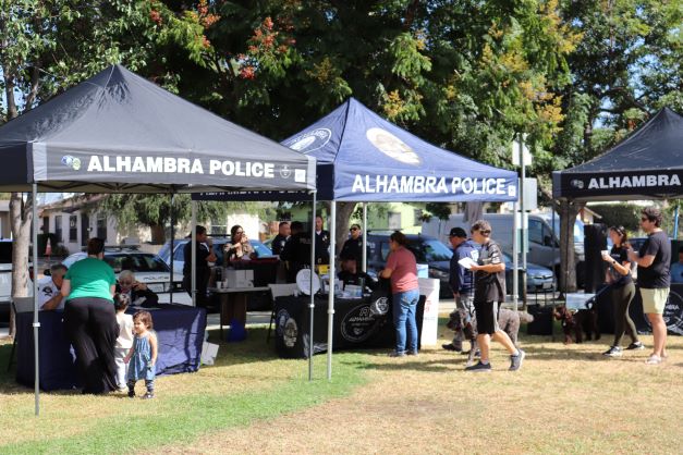 Alhambra Police welcoming guests to their Know Your Neighbor event.