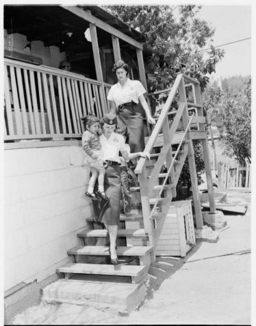 Two women and a girl are escorted out of their homes.