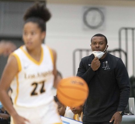 Head Coach Torino Johnson makes in game adjustments.