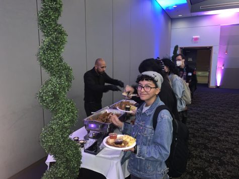 Attendees enjoy cultural dishes at the Black brunch. Photo by Braylin Collins.