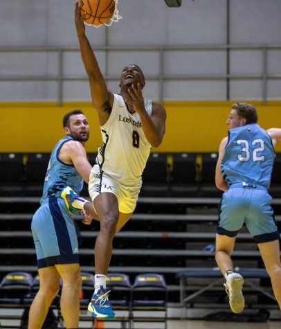 CSULA guard Payton Moore attempts an under-the-basket layup during the Golden Eagles 70-56 loss to Sonoma St. at University Gym on Thursday, Feb. 23, 2023. Photo by Xavier Zamora.